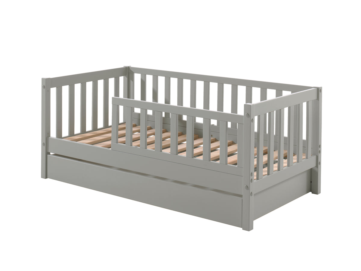 Cette combinaison TODDLER se compose du lit de tout-petit (70 x 140 cm) gris avec le tiroir de rangement assorti.